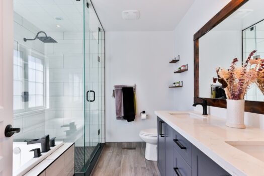 A serene and bright bathroom with natural light, featuring plants and eco-friendly products.